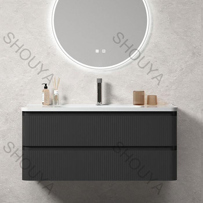 Armarios de baño negros a medida con frentes acanalados en color carbón, almacenamiento suspendido, dos cajones y un espejo redondo con iluminación LED, a granel